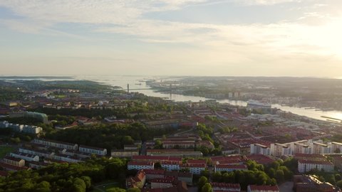 Gothenburg, Sweden. Panorama of the city and the river Goeta Elv with ships. Sunset, Aerial View
