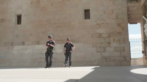 BARCELONA, SPAIN - MAY 19, 2019: Police officers in black uniform in monastery of Montserrat