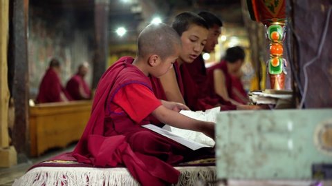 Thiksay , Jammu Kashmir / India - 07 01 2018: Reading sacred book in a Tibetan Buddhist monastery, Ladakh India