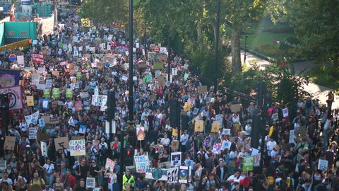 LONDON, UK - 20 SEP 2019; Climate Marching Group Protesters Large crowd with Banners. Camera top view from Above
