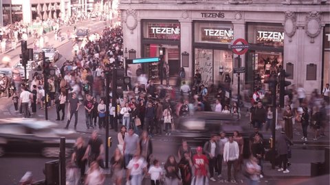 LONDON- SEPTEMBER, 2019: Time lapse of crowds of people and traffic on Oxford Circus, a London landmark and famous shopping destination