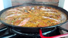 Valenciana Paella
Plate of rice with vegetables, chicken, rabbit or seafood, typical of the area of Valencia Spain.