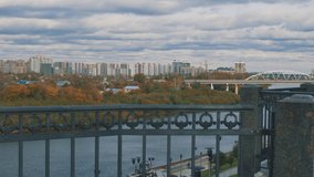 Tyumen, Russia - September 2019: 
Beautiful embankment of Tyumen with a view of the bridge Chelyuskintsev and river Tura. Video bitrate of 100 megabits.