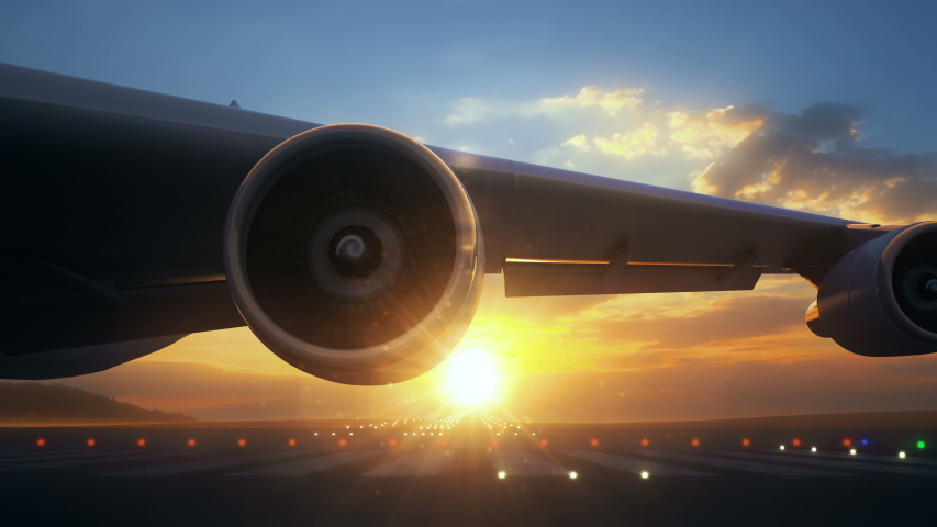 Camera moving close to airplane wing showing its engines rotating. The airplane is on runway and ready to start taking off procedure. Beautiful sunset seen behind the airplane. Royalty-Free Stock Footage #1037629508
