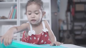 Slow Motion Clip,Little girl helping mother to fold clothes.