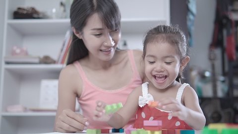 Slow Motion Clip,Mother and daughter playing english alphabet.