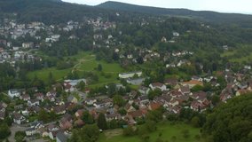 Aerial view of the city Badenweiler in Germany on a late cloudy day in summer.  Descend beside the city.