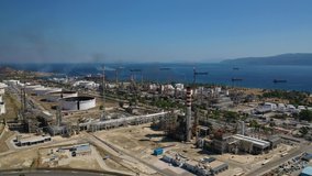 Aerial drone video of famous full working plant and oil refinery in Corinth area, Greece