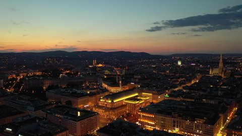 night sunset illumination flight over vienna city opera house district aerial panorama 4k austria