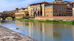 Little boats on the Arno river in Florence, Tuscany, Italy. Time lapse video.