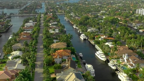 Mansions yachts and palm trees Fort Lauderdale aerial tour 4k