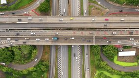 Aerial footage 4k top view of car traffic, transportation on the ring road bo leaf shape Bangkok Thailand 