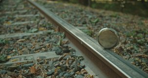 mans hand taking flask with whiskey from rails . Railway concept . - Powered by Shutterstock - Get 15% off with code: PIKWIZARD15