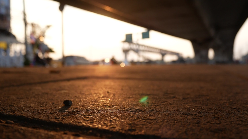 Close up footpath pavement sidewalk under bridge with traffic in twilight. | Shutterstock HD Video #1037740037