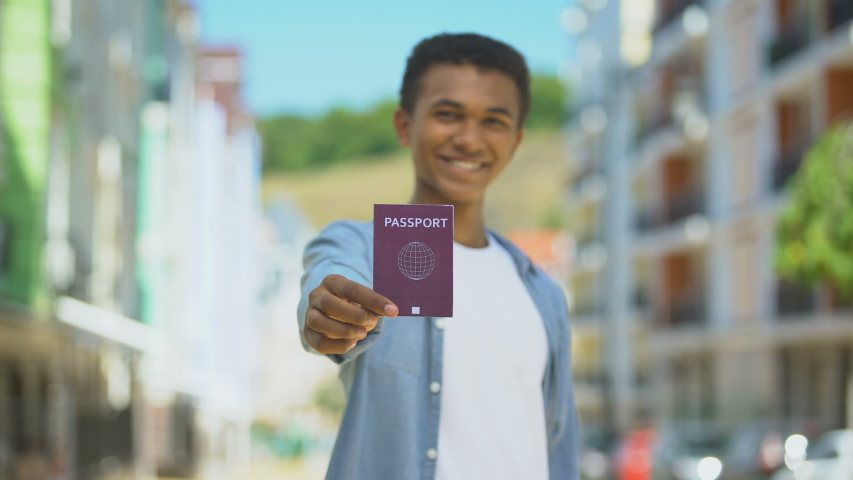 Show your passport. Afroamerican man photo for Passport. Showing Passport. Selfie with Passport Afro-American.