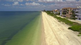 Aerial footage beautiful Barefoot Beach Naples FL