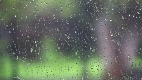 Falling rain drops on Window 