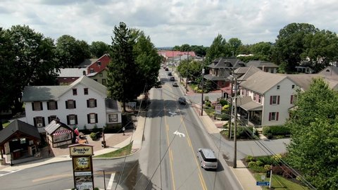 Intercourse , Pennsylvania / United States - 08 31 2019: Slow aerial dolly shot featuring small shops in Lancaster County PA Amish tourist country