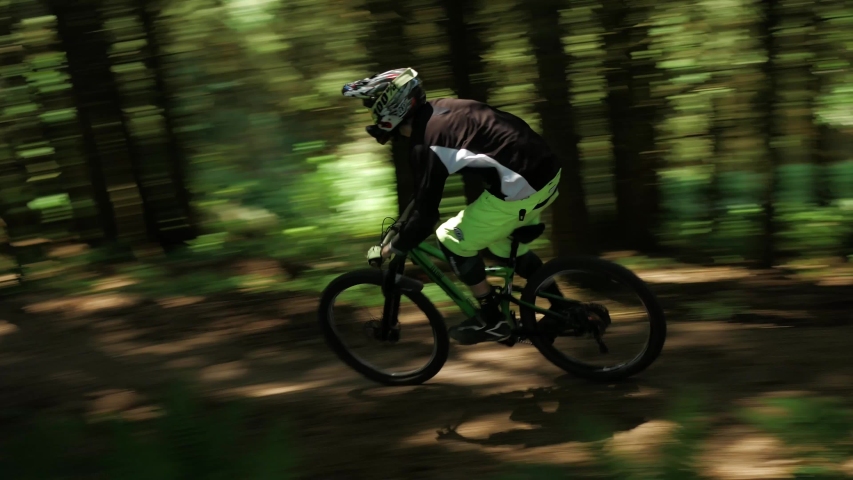 Barnstaple / United Kingdom (UK) - 05 20 2019: Mountain Biker Biking On Mtb with a lot of speed down the mountain in the forest.