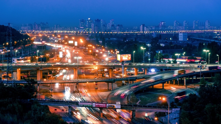 KIEV, UKRAINE - 15 of SEPTEMBER 2019: Time lapse of evening car traffic at the city. Kyiv night city view, Ukraine