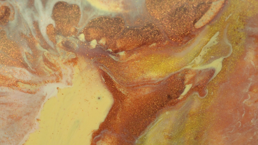 Pale yellow, beige, golden ocher, glitter gold, copper and sienna colors mix. Fluid background.  Real liquid oil paint. Marble texture in motion Royalty-Free Stock Footage #1037778926