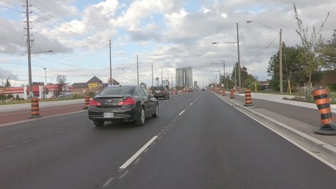 Vaughan, Ontario, Canada September 2019 POV Driving plate in suburban area city streets with traffic 