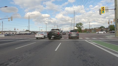 Vaughan, Ontario, Canada September 2019 POV Driving plate in suburban area city streets with traffic 