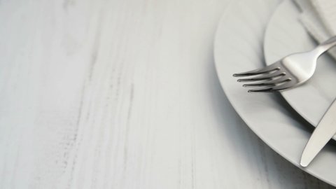 white ceramic plates and cutlery