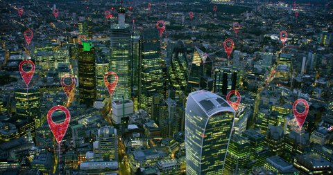 Aerial smart city. Localization icons in a connected futuristic city.  Technology concept, data communication, artificial intelligence, internet of things. London skyline. Shot on Red Weapon 8K.