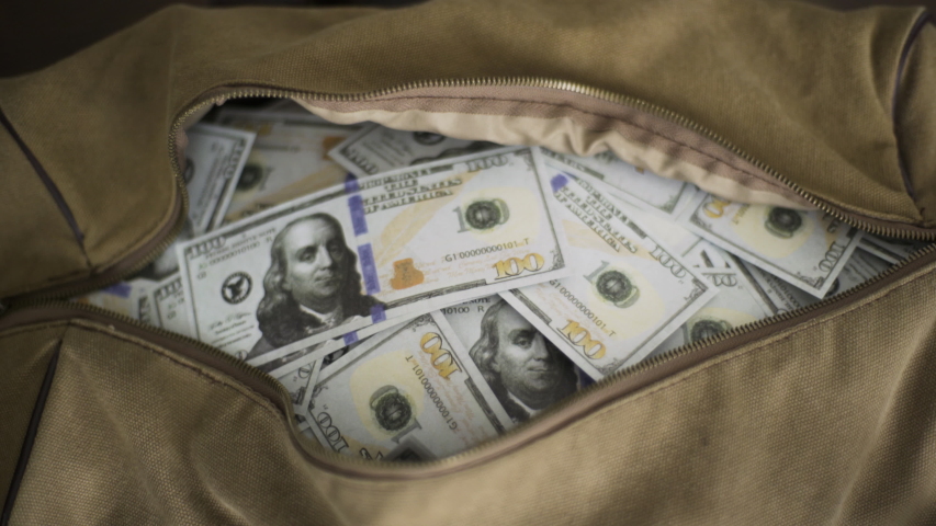 A bag filled with $100k Cash Royalty-Free Stock Footage #1037805395