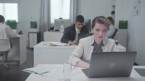 Woman at the office with a laptop.