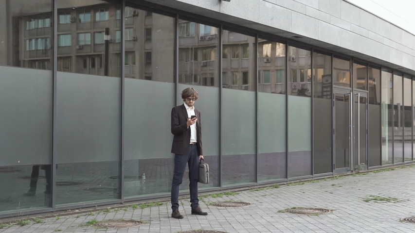 Diplomat talking on the phone near the office