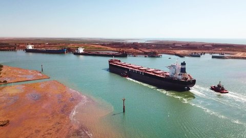 Port Hedland , Western Australia / Australia - 08 25 2019: Bulk carrier ships are integral to the transport of Australian mining exports.