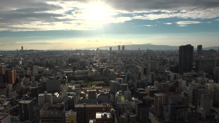 OSAKA, JAPAN - CIRCA JULY 2019 : Aerial view of CITYSCAPE of OSAKA in early evening. Osaka is the capital city of Osaka Prefecture and the second largest metropolitan area in Japan.