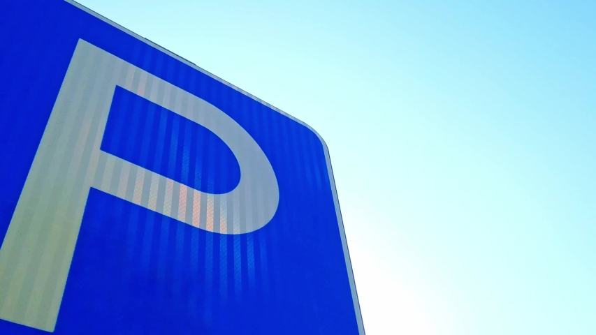 Parking road sign close-up with blue sky