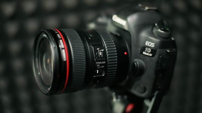 Lviv, Ukraine - July 6, 2019: Close-up of professional black digital camera Canon on a tripod in the recording studio. | Shutterstock HD Video #1037849345