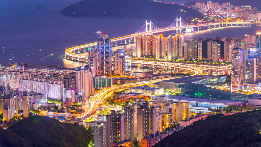 Timelapse Top view of Gwangan Bridge and Haeundae at night. Busan City, South Korea.