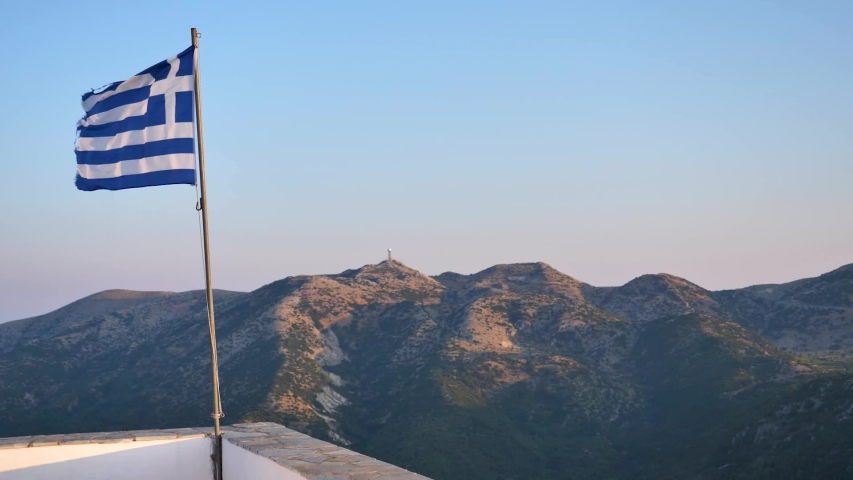 greek flag in wind with mountins 3_FullHD