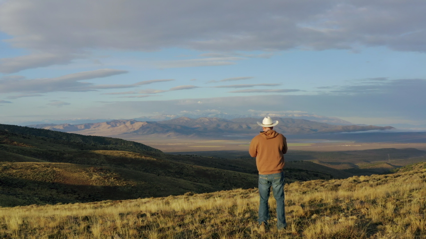 Cowboy looking out over vista