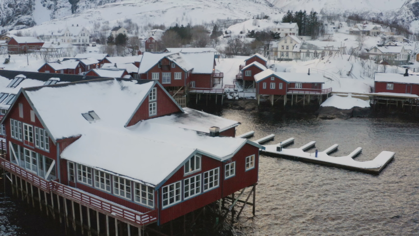 evening view of famous traditional multicolored wooden fishing houses rorbu on a sea shore at Lofoten archipelago, nothern Norway
