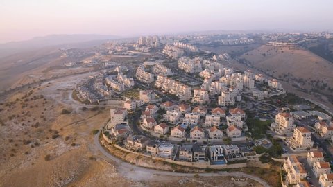 Maala Adumim settlement in Israel, sunrise, 4k aerial drone view