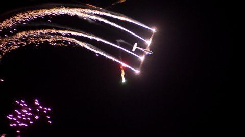 Airplanes Aerobatics at Night with Sparks and Fireworks Air Show Slow Motion