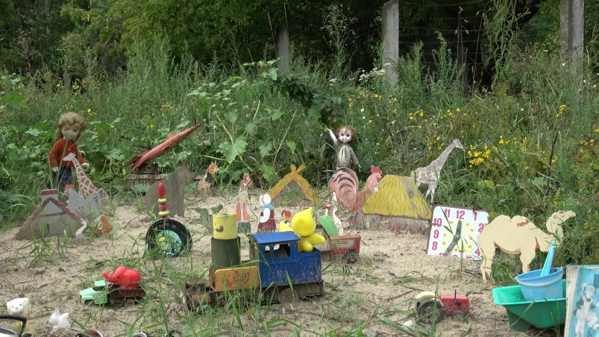 Chernobyl, Ukraine - 8th of August 2019: At the crossing point to the Chernobyl exclusion zone - Viewing outdoor exhibition of childen toys found in the Chernobyl zone
