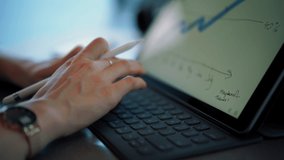 Cropped video of skilled female economist typing data information on portable keyboard for making accounting on digital tablet, selective focus on hands using modern touch pad and electronic stylus
 - Powered by Shutterstock - Get 15% off with code: PIKWIZARD15