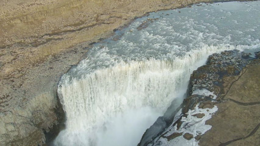 Dettifoss Powerful Waterfall in Summer Evening. Iceland. Aerial View. Drone Flies Forward, Tilt Down