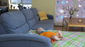 man father hands hoover dust from sofa around baby daughter. home clean and child care. Multitasking. 4K UHD video clip.