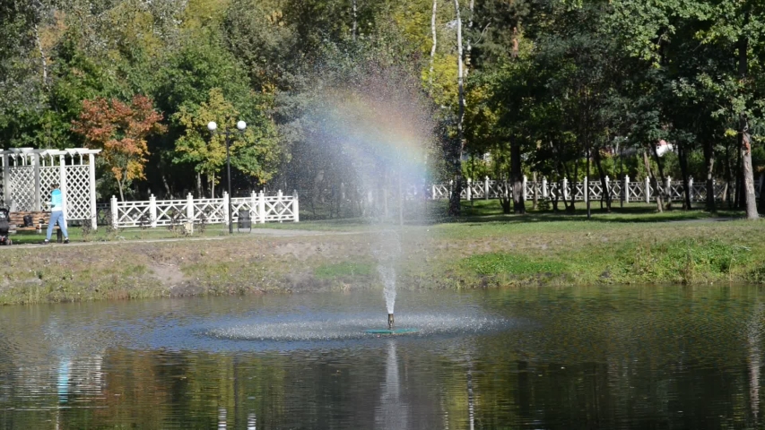 Landscape with a Beautiful Rainbow in a Fountain