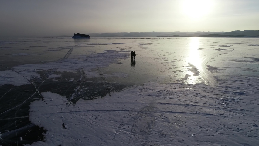walking over frozen Baikal Lake.