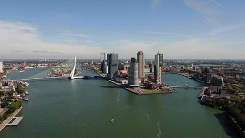 4k aerial video of the Rotterdam skyline seen from the Maas river, with the Erasmusbridge