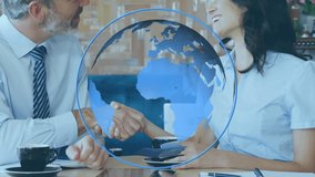 Animation of a close up of smartly dressed diverse Caucasian business people shaking hands with a Caucasian woman using a laptop in the background and blue globe turning and white digital data - Powered by Shutterstock - Get 15% off with code: PIKWIZARD15